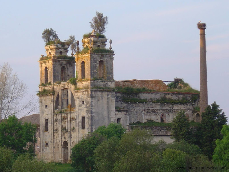Spooky Place in Portugal, in Figueira da Foz. The scene is the end of the day, with sunset lighting on the building. There is a stone building with two towers in the front (like monasteries) and the roof is half destroyed. It is an abandoned building surrounded by nature.